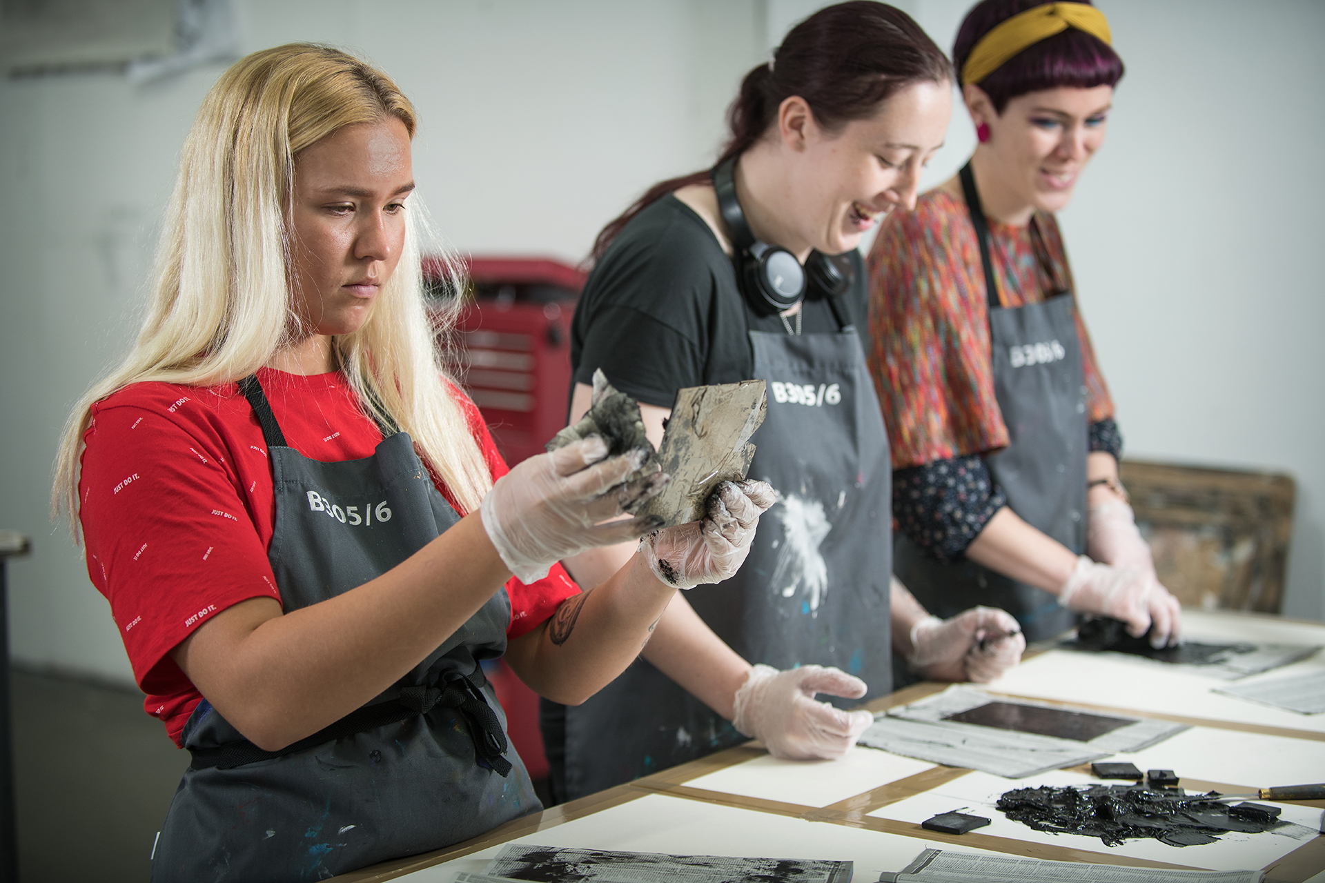 Art students working on a project in an art studio classroom.